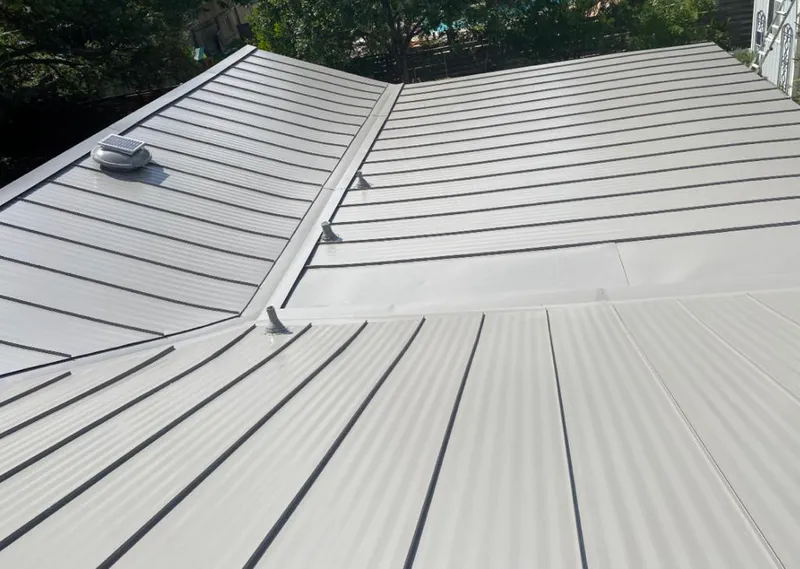 Solar attic fan installed on a metal roof for Roof Ventilation in Bailey's Crossroads